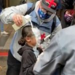 One man poured milk over the girl's head after she was allegedly pepper-sprayed by police (Image: evanmichael/Instagram)