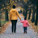 boy walking with mum