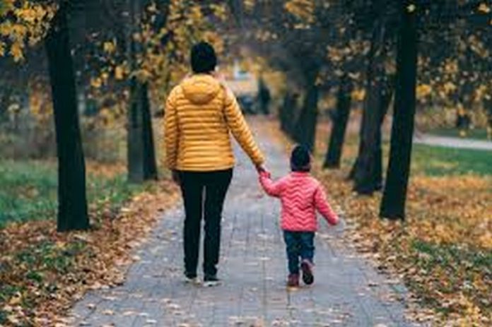 boy walking with mum