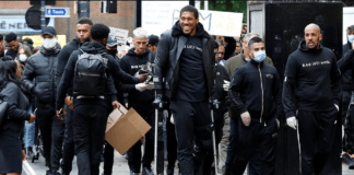 Anthony Joshua hobbles on crutches as he joins Black Lives Matter protest