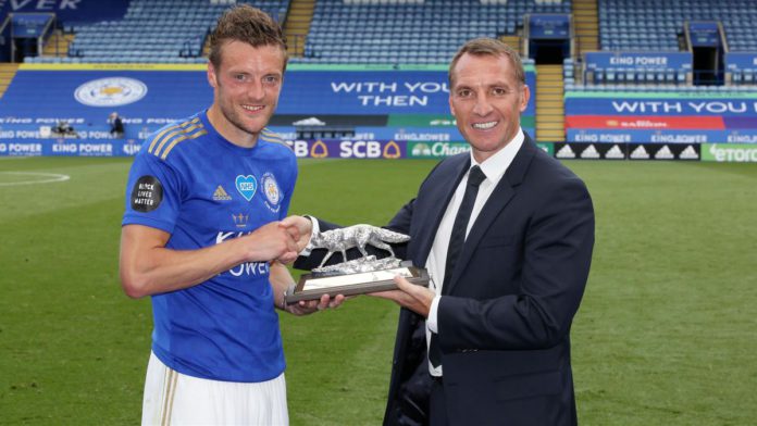 Jamie Vardy of Leicester City is presented with a silver fox by Leicester City Manager Brendan Rodgers, to commemorate scoring 100 Premier League goals Image credit: Getty Images