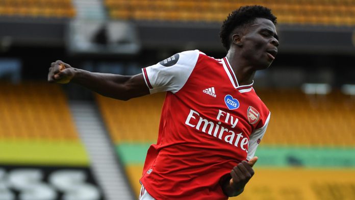 Bukayo Saka of Arsenal celebrates after scoring a goal to make it 0-1 during the Premier League match between Wolverhampton Wanderers and Arsenal FC at Molineux on July 4, 2020 Image credit: Getty Images