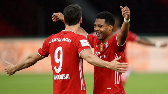 Robert Lewandowski of FC Bayern Muenchen celebrates with teammate Serge Gnabry of FC Bayern Muenchen after scoring his team's third goal during the DFB Cup final match between Bayer 04 Leverkusen and FC Bayern Muenchen at Olympiastadion on July 04 Image credit: Getty Images