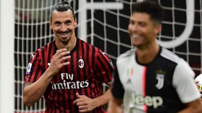 Zlatan Ibrahimovic celebrates scoring for AC Milan as Cristiano Ronaldo looks on. Image credit: Getty Images