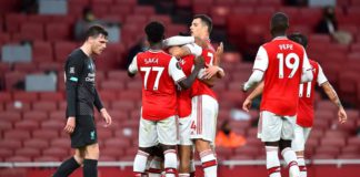 Reiss Nelson of Arsenal celebrates with teammates after scoring his sides second goal during the Premier League match between Arsenal FC and Liverpool FC at Emirates Stadium on July 15, 2020 in London, England. Image credit: Getty Images