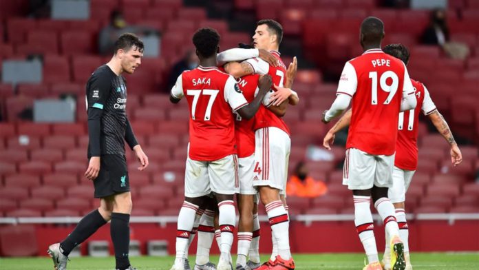Reiss Nelson of Arsenal celebrates with teammates after scoring his sides second goal during the Premier League match between Arsenal FC and Liverpool FC at Emirates Stadium on July 15, 2020 in London, England. Image credit: Getty Images