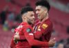 Alex Oxlade-Chamberlain (L) celebrates with Roberto Firmino after scoring for Liverpool against Chelsea. Image credit: Getty Images