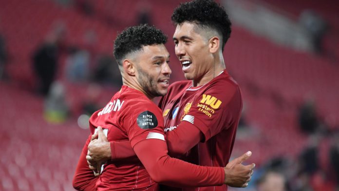 Alex Oxlade-Chamberlain (L) celebrates with Roberto Firmino after scoring for Liverpool against Chelsea. Image credit: Getty Images