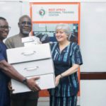 This screenshot from the U.S. Embassy in Ghana website shows Ambassador Stephanie Sullivan, right, donating technology to the executive director of the Economic and Organized Crime Office, Frank Adu-Poku, rear, and Jacob Puplampu, left, at a “cyber dark web investigations training” session in Accra in May 2019.