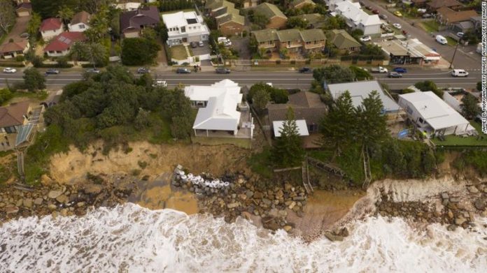 CENTRAL COAST, AUSTRALIA - JULY 17: An aerial view of the coastal erosion to local homes in the suburb of Wamberal on July 17, 2020 in Central Coast, Australia. Beachfront homes along the NSW Central Coast are at risk of collapse due to beach erosion after huge swells hit the states beaches on Thursday. (Photo by James D. Morgan/Getty Images)