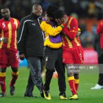 JOHANNESBURG, SOUTH AFRICA – JULY 02: Asamoah Gyan is consoled by Derek Boateng after Ghana are knocked out in a penalty shoot-out during the 2010 FIFA World Cup South Africa Quarter Final match between Uruguay and Ghana at the Soccer City stadium on July 2, 2010, in Johannesburg, South Africa. (Photo by Clive Mason/Getty Images)
