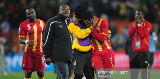 JOHANNESBURG, SOUTH AFRICA – JULY 02: Asamoah Gyan is consoled by Derek Boateng after Ghana are knocked out in a penalty shoot-out during the 2010 FIFA World Cup South Africa Quarter Final match between Uruguay and Ghana at the Soccer City stadium on July 2, 2010, in Johannesburg, South Africa. (Photo by Clive Mason/Getty Images)