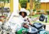Gifty Anti's daughter, Nyame Anuonyam poses on father's motorbike