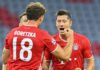 Bayern Munich's Polish forward Robert Lewandowski (R) celebrates with his teammate Bayern Munich's German midfielder Leon Goretzka after scoring his team's first goal during the UEFA Champions League, second-leg round of 16, football match FC Bayern Munic Image credit: Getty Images