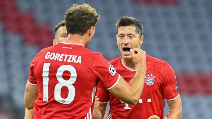 Bayern Munich's Polish forward Robert Lewandowski (R) celebrates with his teammate Bayern Munich's German midfielder Leon Goretzka after scoring his team's first goal during the UEFA Champions League, second-leg round of 16, football match FC Bayern Munic Image credit: Getty Images