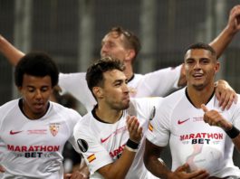 Diego Carlos of Sevilla FC (R) and team mates celebrate their team's third goal, an own goal scored by Romelu Lukaku of Inter Milan (not pictured) during the UEFA Europa League Final between Seville and FC Internazionale at RheinEnergieStadion on August 2 Image credit: Getty Images
