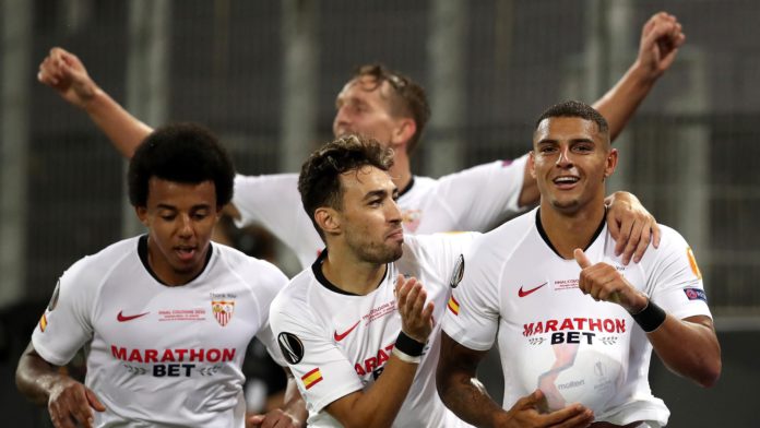 Diego Carlos of Sevilla FC (R) and team mates celebrate their team's third goal, an own goal scored by Romelu Lukaku of Inter Milan (not pictured) during the UEFA Europa League Final between Seville and FC Internazionale at RheinEnergieStadion on August 2 Image credit: Getty Images
