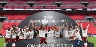 Arsenal's Gabonese striker Pierre-Emerick Aubameyang lifts the trophy after winning the English FA Community Shield football match between Arsenal and Liverpool at Wembley Stadium in north London on August 29, 2020. - Arsenal won the match 5-4 in a penalty shootout after drawing 1-1 in normal time. (Photo by JUSTIN TALLIS / POOL / AFP) / NOT FOR MARKETING OR ADVERTISING USE / RESTRICTED TO EDITORIAL USE