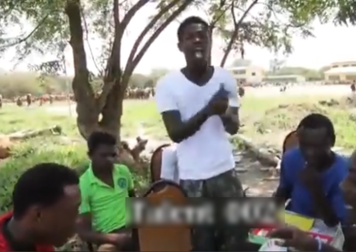 Singer Fameye in a white t-shirt shows off his rap prowess before the limelight