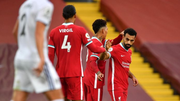 MOHAMED SALAH OF LIVERPOOL CELEBRATES WITH ROBERTO FIRMINO AFTER SCORING HIS TEAM'S THIRD GOAL DURING THE PREMIER LEAGUE MATCH BETWEEN LIVERPOOL AND LEEDS UNITED AT ANFIELD ON SEPTEMBER 12, 2020 IN LIVERPOOL, ENGLAND IMAGE CREDIT: GETTY IMAGES