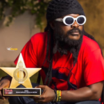 Ras Kuuku poses with his VGMA plaque
