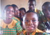 Gideon Nhyiraba and some of his classmates take a picture after writing BECE
