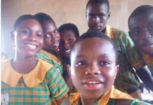 Gideon Nhyiraba and some of his classmates take a picture after writing BECE