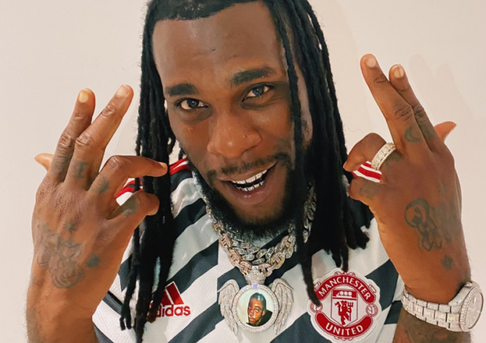 Burna Boy wears new Manchester United football jersey