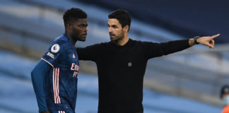 MANCHESTER, ENGLAND - OCTOBER 17: Thomas Partey of Arsenal gets some instructions from Arsenal Manager Mikel Arteta during the Premier League match between Manchester City and Arsenal at Etihad Stadium on October 17, 2020 in Manchester, England. (Photo by David Price/Arsenal FC via Getty Images)