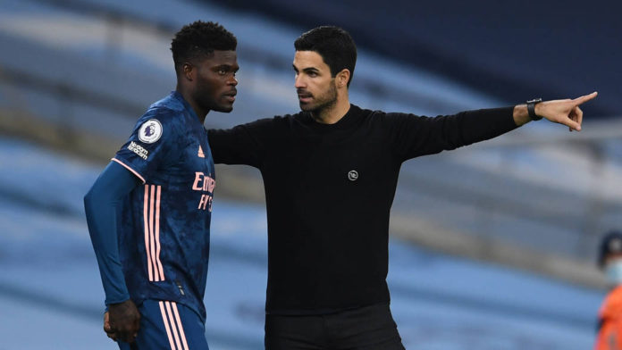 MANCHESTER, ENGLAND - OCTOBER 17: Thomas Partey of Arsenal gets some instructions from Arsenal Manager Mikel Arteta during the Premier League match between Manchester City and Arsenal at Etihad Stadium on October 17, 2020 in Manchester, England. (Photo by David Price/Arsenal FC via Getty Images)