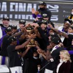 The Los Angeles Lakers players celebrate after the Lakers defeated the Miami Heat 106-93 in Game 6 of basketball's NBA Finals Sunday, Oct. 11, 2020, in Lake Buena Vista, Fla. (AP Photo/John Raoux)