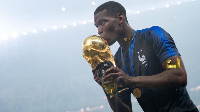 MOSCOW, RUSSIA - JULY 15: Paul Pogba of France celebrates with the World Cup Trophy following his sides victory in the 2018 FIFA World Cup Final between France and Croatia at Luzhniki Stadium on July 15, 2018 in Moscow, Russia. (Photo by Matthias Hangst/Getty Images)