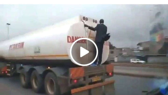 Man in suit and tie spotted riding to work on the back of a fuel tanker_ICC_Change