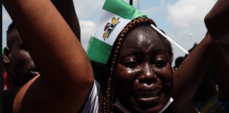 Nigerian woman sheds tears during Lekki protests