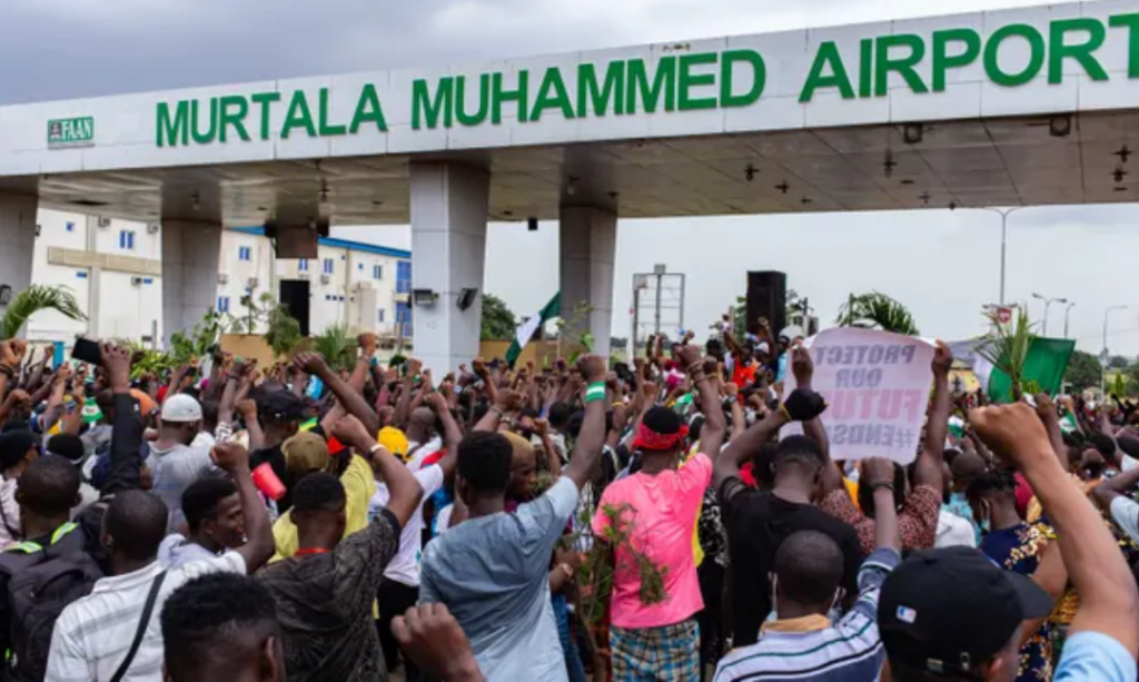  A one-minute silence on Monday among the crowds near Murtala Muhammed airport, Lagos, to remember ‘lives lost to police brutality’. Photograph: Benson Ibeabuchi/AFP/Getty
