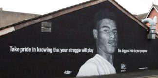 BASED ON PHOTO BY DANIEL CHEETHAM image caption Street artist Akse says Marcus Rashford has "inspired the whole nation"