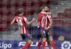 Yannick Carrasco of Atletico de Madrid celebrates with teammate Marcos Llorente and Saul Niguez after scoring his team's first goal during the La Liga Santander match between Atletico de Madrid and FC Barcelona at Estadio Wanda Metropolitano Image credit: Getty Images