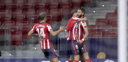 Yannick Carrasco of Atletico de Madrid celebrates with teammate Marcos Llorente and Saul Niguez after scoring his team's first goal during the La Liga Santander match between Atletico de Madrid and FC Barcelona at Estadio Wanda Metropolitano Image credit: Getty Images