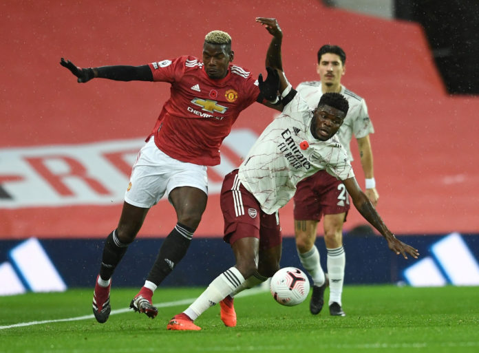 Partey battles Pogba at Old Trafford