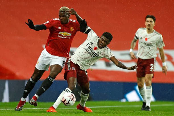 Thomas Partey tackles Pogba