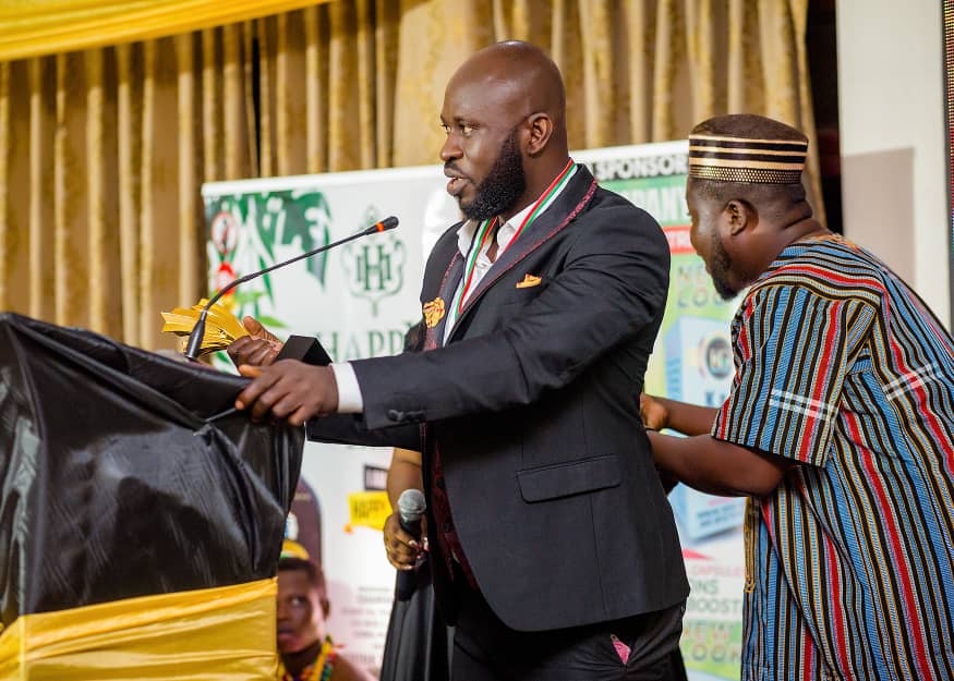 Ampofo Adjei receiving an award on behalf of Adom TV