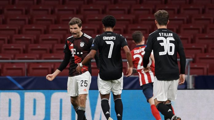 Thomas Muller of Bayern celebrates after scoring his sides first goal during the UEFA Champions League Group A stage match between Atletico Madrid and FC Bayern Muenchen at Estadio Wanda Metropolitano on December 1, 2020 in Madrid, Spain. Image credit: Getty Images