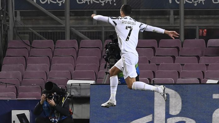 Juventus' Portuguese forward Cristiano Ronaldo celebrates after scoring a goal during the UEFA Champions League group G football match between Barcelona and Juventus at the Camp Nou stadium in Barcelona on December 8, 2020. Image credit: Getty Images