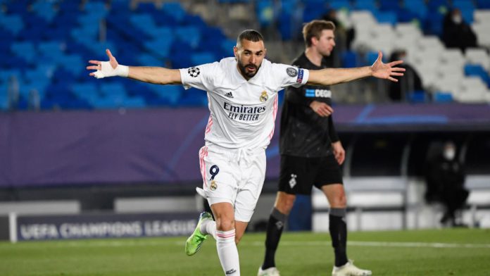 Real Madrid's French forward Karim Benzema celebrates after scoring during the UEFA Champions League group B football match between Real Madrid and Borussia Moenchengladbach at the Alfredo Di Stefano stadium in Valdebebas, northeast of Madrid, on December Image credit: Getty Images