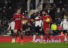 Liverpool's Egyptian midfielder Mohamed Salah (2nd R) celebrates with Liverpool's English midfielder Jordan Henderson after scoring their first goal from the penalty spot during the English Premier League football match between Fulham and Liverpool at Cra Image credit: Getty Images