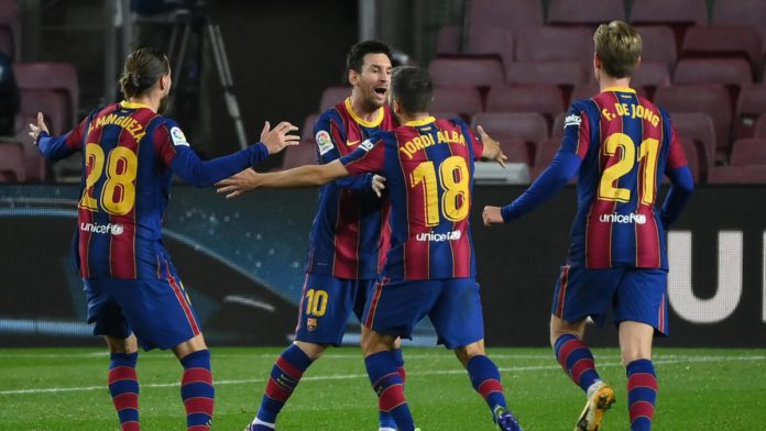Barcelona's Spanish defender Jordi Alba celebrates his goal with Barcelona's Argentinian forward Lionel Messi during the Spanish league football match between FC Barcelona and Real Sociedad at the Camp Nou stadium in Barcelona on December 16, 2020. Image credit: Getty Images