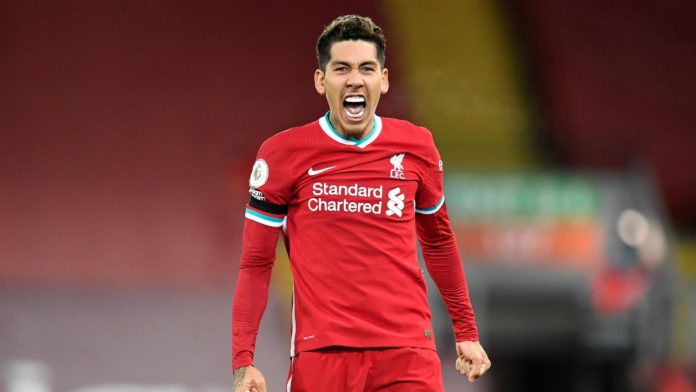 Liverpool's Brazilian midfielder Roberto Firmino celebrates scoring his team's second goal during the English Premier League football match between Liverpool and Tottenham Hotspur at Anfield in Liverpool, north west England on December 16, 2020. Image credit: Getty Images