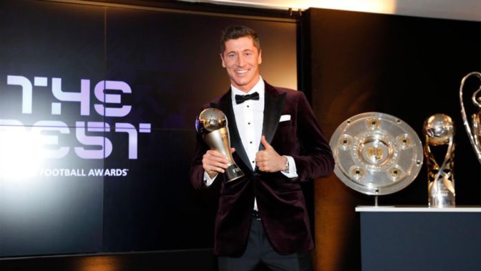 Robert Lewandowski of FC Bayern Muenchen poses after winning the FIFA Men's Player 2020 trophy during the FIFA The BEST Awards ceremony on December 17, 2020 in Munich, Germany. Image credit: Getty Images