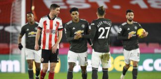 Marcus Rashford of Manchester United celebrates with team mate Alex Telles after scoring their sides first goal during the Premier League match between Sheffield United and Manchester United at Bramall Lane Image credit: Getty Images