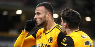 Romain Saiss of Wolverhampton Wanderers celebrates with teammate Pedro Neto after scoring their team's first goal during the Premier League match between Wolverhampton Wanderers and Tottenham Hotspur Image credit: Getty Images
